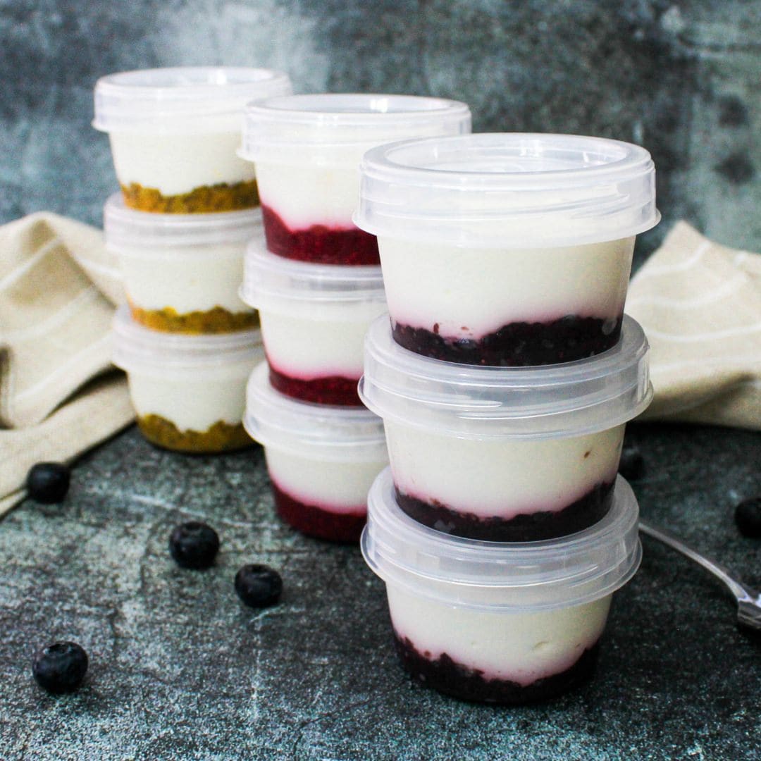9 cups of yogurt with fruit compote on the bottom, in 3 different flavors.