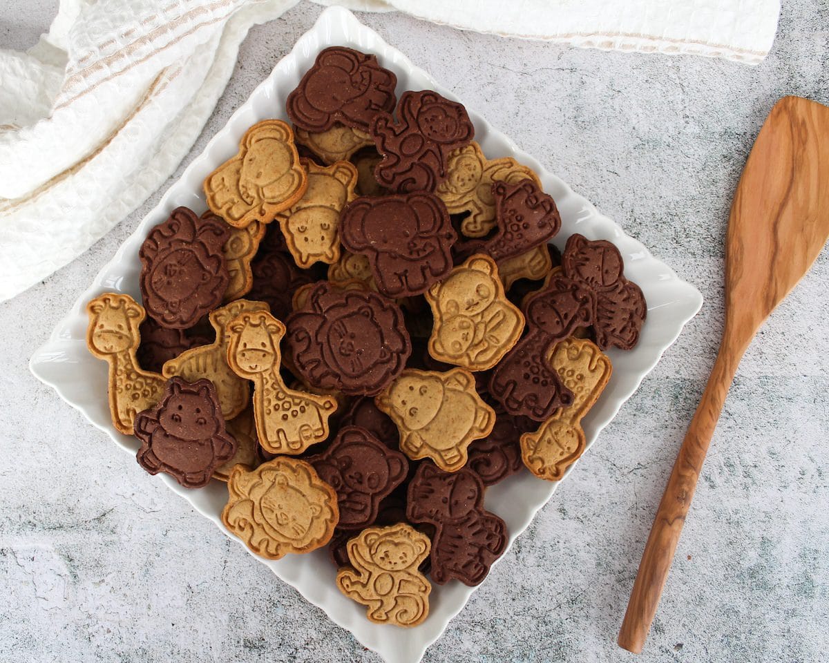 Plate of brown and beige animal crackers.
