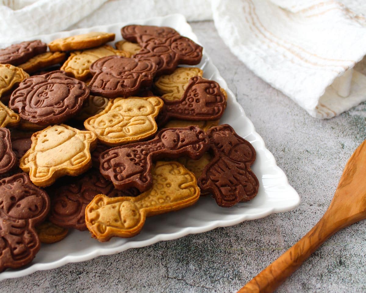 Plate of brown and beige animal crackers.